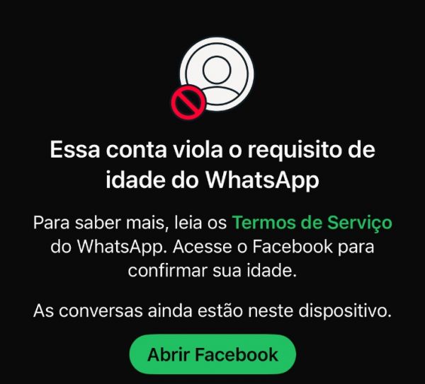 Tela do WhatsApp: Essa conta viola o requisito de idade do WhatsApp. Botão Abrir Facebook.